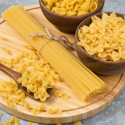 bowls-raw-dry-pasta-spaghetti-marble-surface