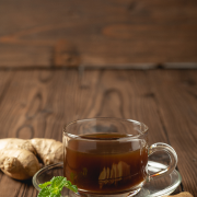 hot-ginger-juice-ginger-sliced-wooden-table